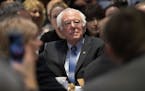 Democratic presidential candidate Sen. Bernie Sanders, I-Vt., listens as he is introduced during the Politics & Eggs at New Hampshire Institute of Pol