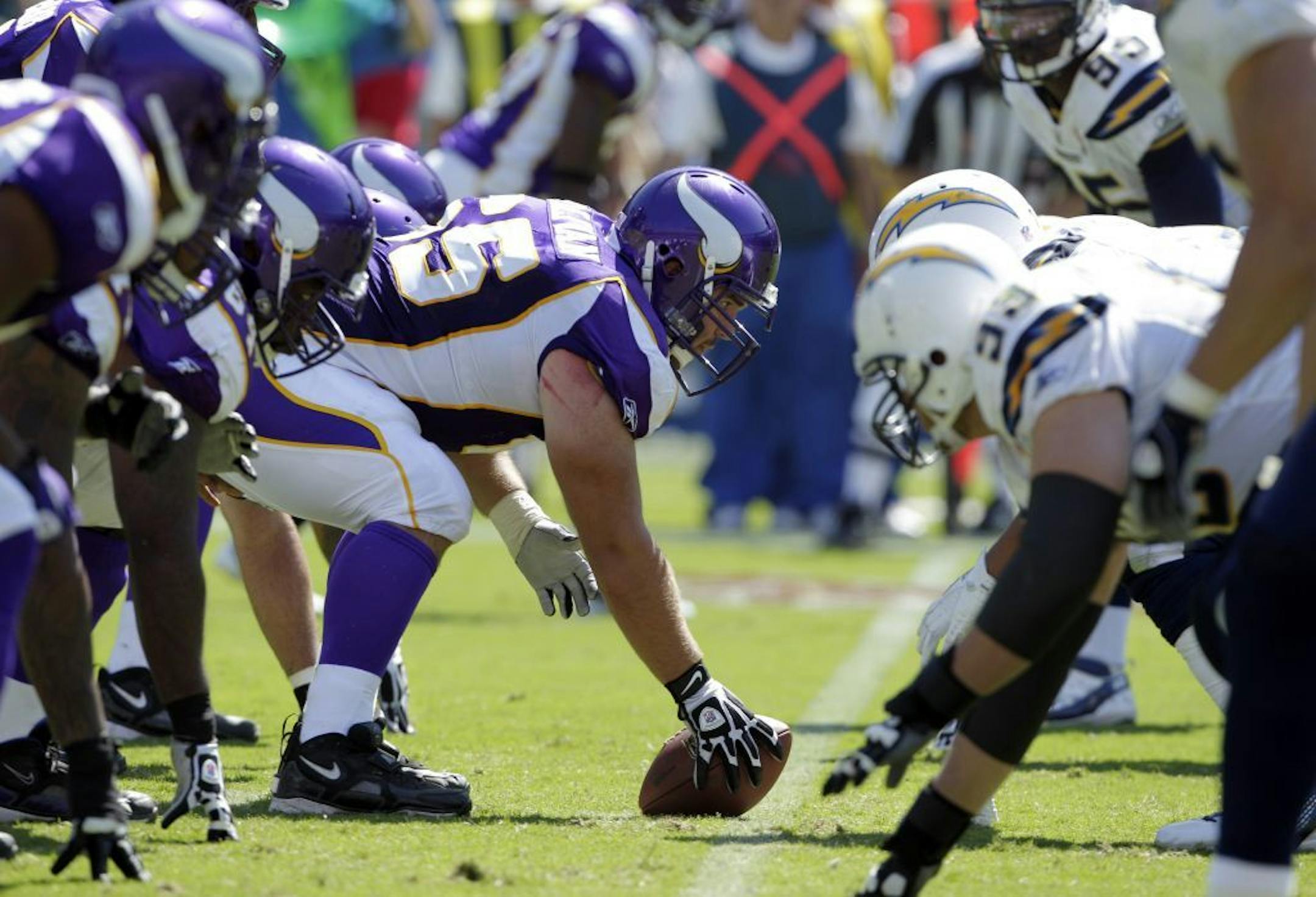 Minnesota Vikings center John Sullivan lines up against the San Diego Chargers defense during the first half of a NFL football game Sunday, Sept. 11, 2011, in San Diego.