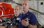 U.S.C.G. Cpt. Mark Fedor, right, and Lt. Cmd. Gabe Somma brief the media on the search for survivors of the cargo ship El Faro that sank during Hurric