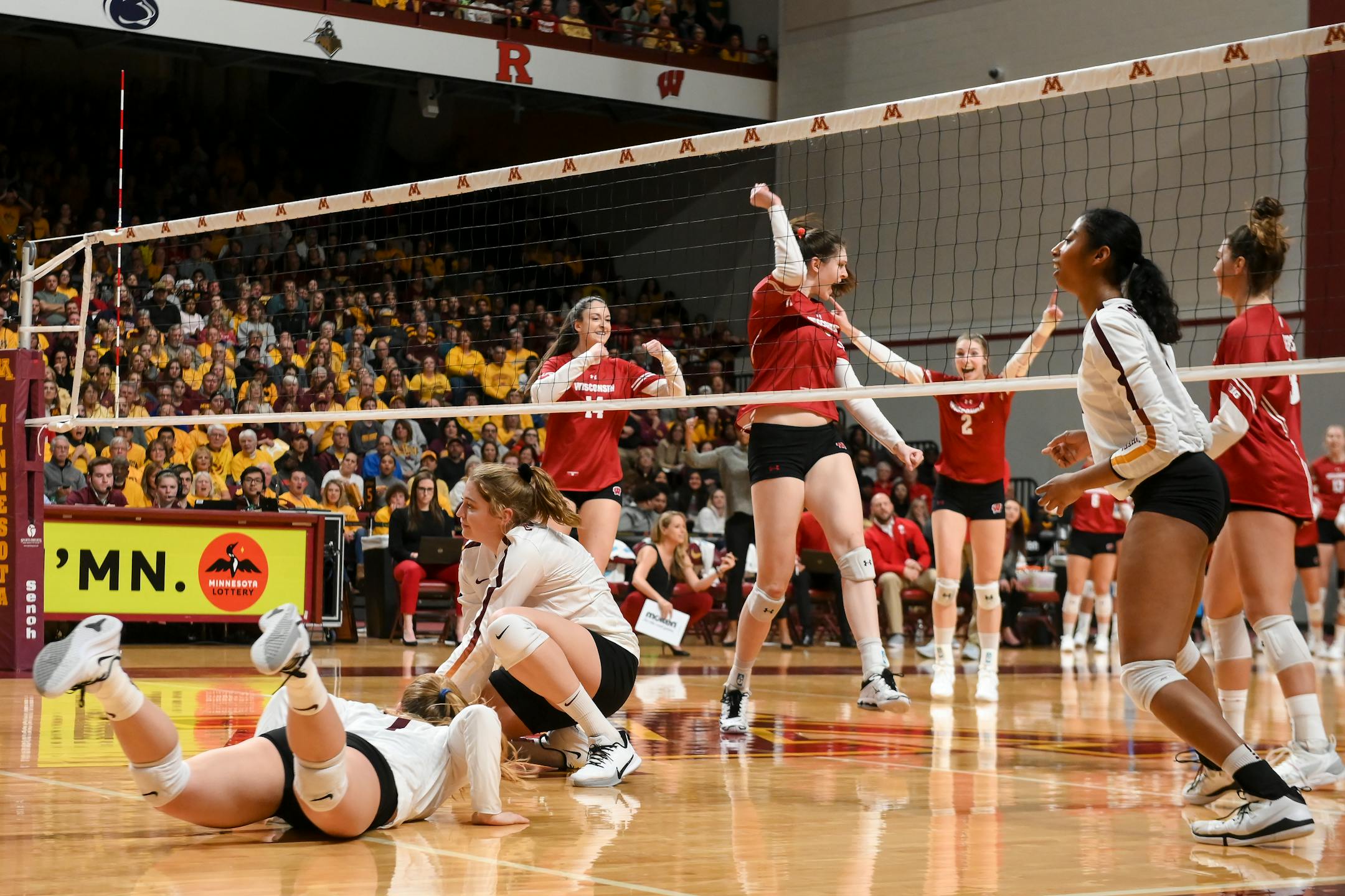 Wisconsin celebrated a point scored against the Gophers in the second set Thursday.