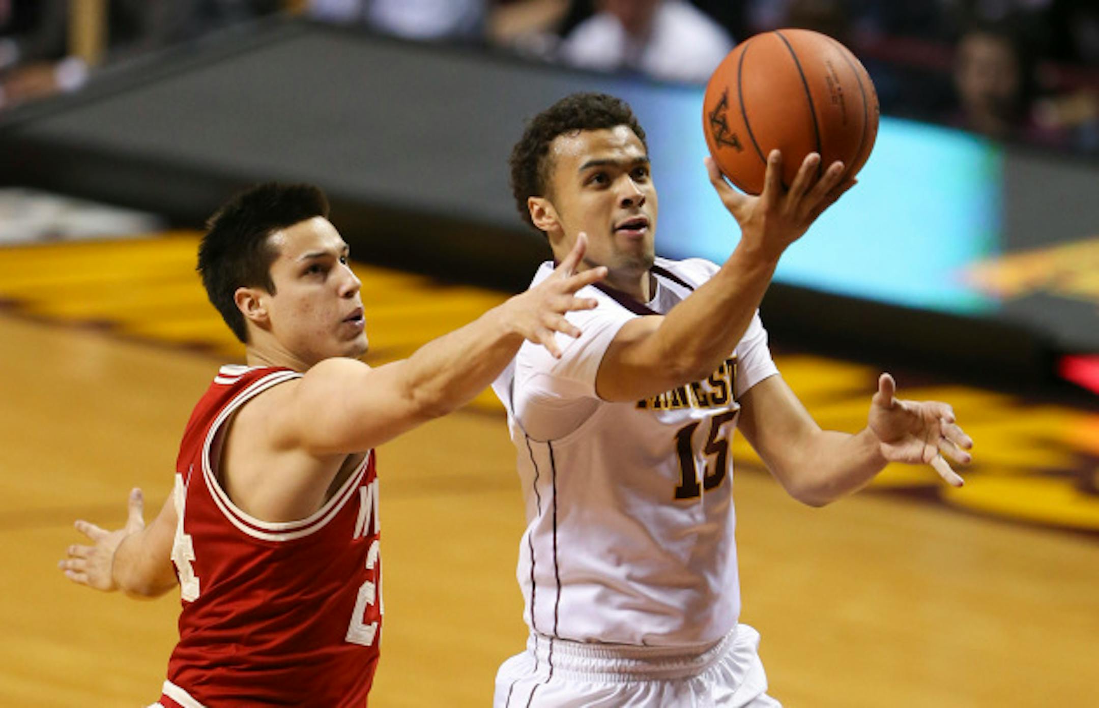 Gophers guard Stephon Sharp (15) put up a shot ahead of Badgers guard Bronson Koenig (24) in the first half Wednesday night.    ]  JEFF WHEELER ' jeff.wheeler@startribune.com    The University of Minnesota men's basketball team faced Wisconsin Wednesday night, March 2, 2016 at Williams Arena in Minneapolis. ORG XMIT: MIN1603022058200212
