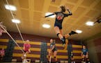Jordan Mitchell jumped up for a spike during Denfeld High School volleyball practice on Tuesday.