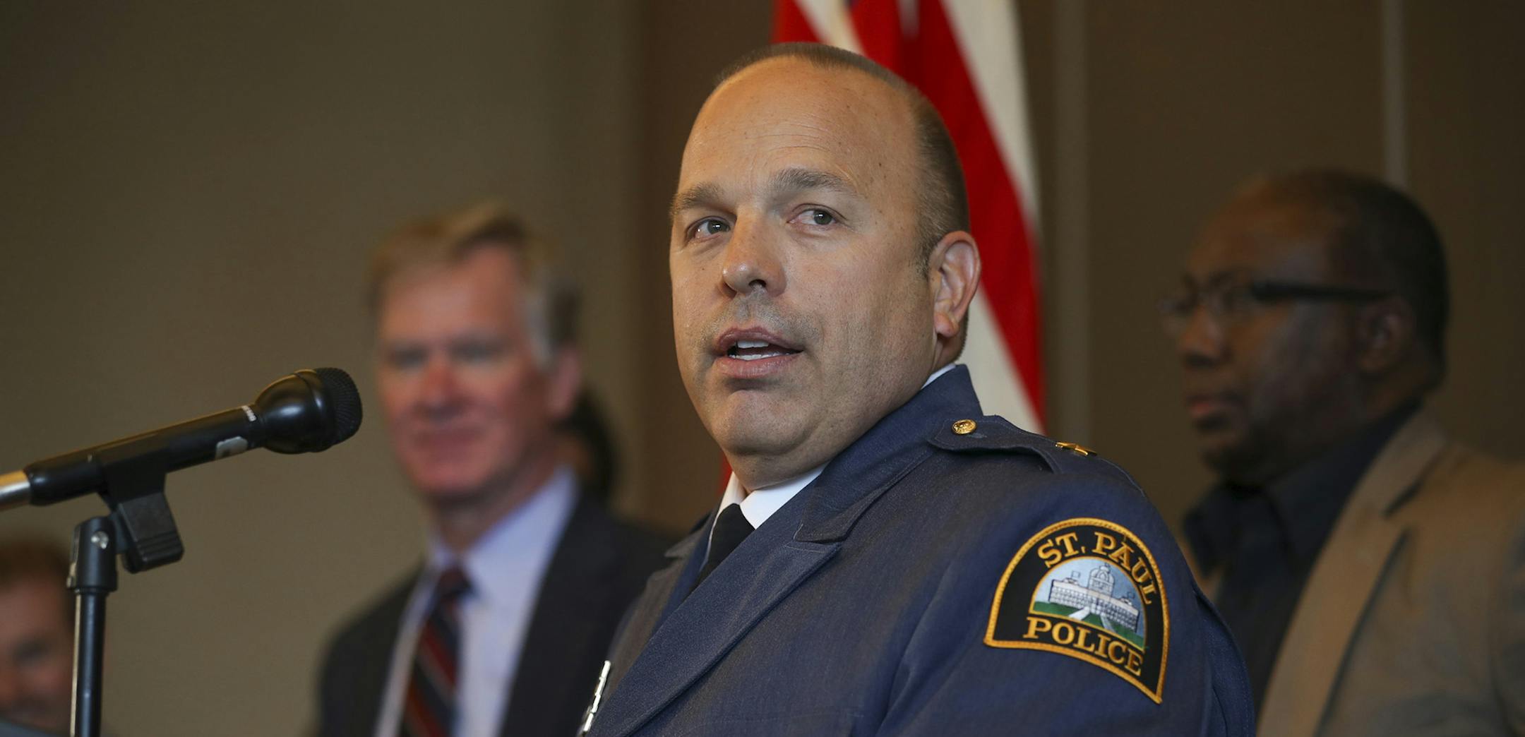 Assistant Police Chief Todd Axtell addressed the audience at the Rondo Library after St. Paul Mayor Chris Coleman, left rear, announced that Axtell was his choice to be Police Chief. ] JEFF WHEELER ï jeff.wheeler@startribune.com St. Paul Mayor Chris Coleman announced the promotion of St. Paul Assistant Police Chief Todd Axtell to the chief's job Monday afternoon, June 13, 2016 at the Rondo Library,. ORG XMIT: MIN1606131653591517
