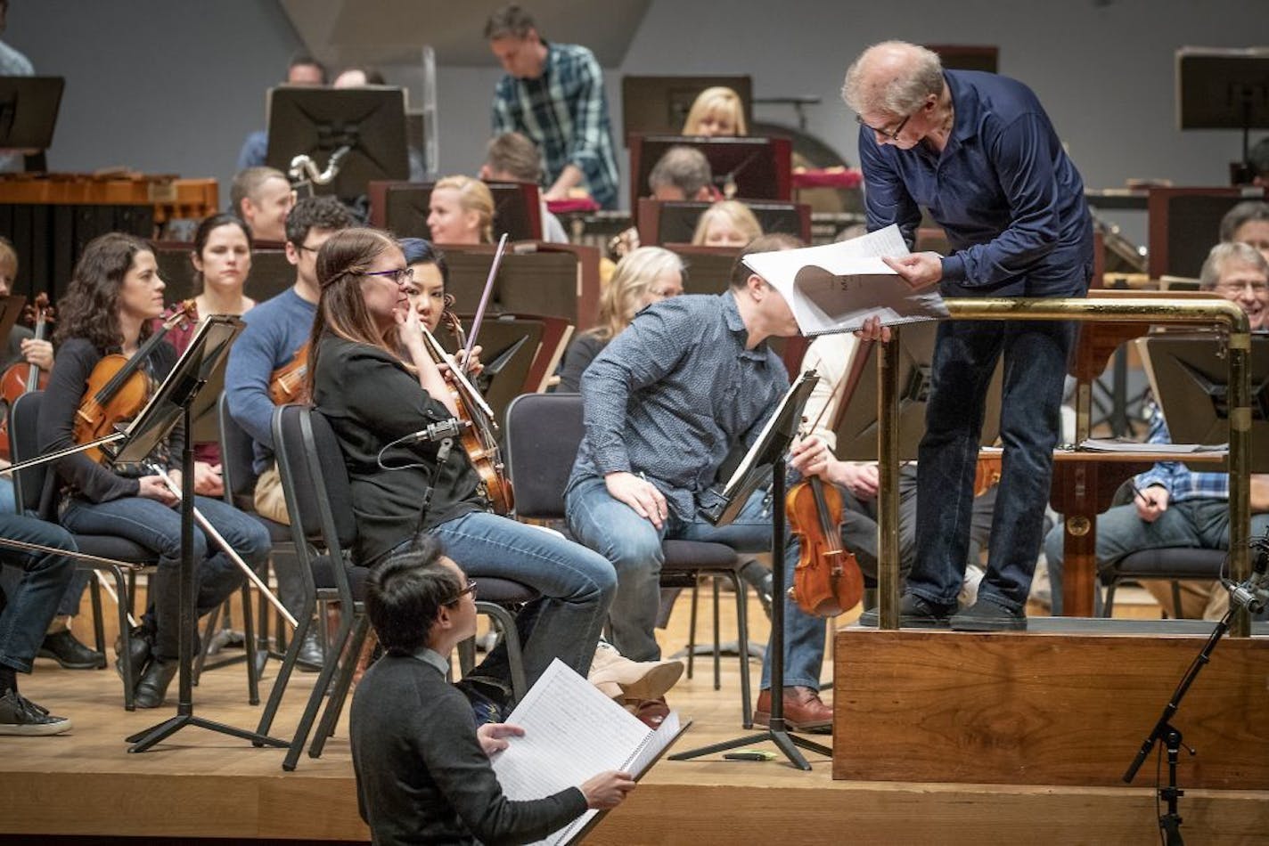 Minnesota Orchestra conductor Osmo Vänskä consulted with composer and Curtis Institute student Viet Cuong as the musicians ran through his piece, "Moxie."