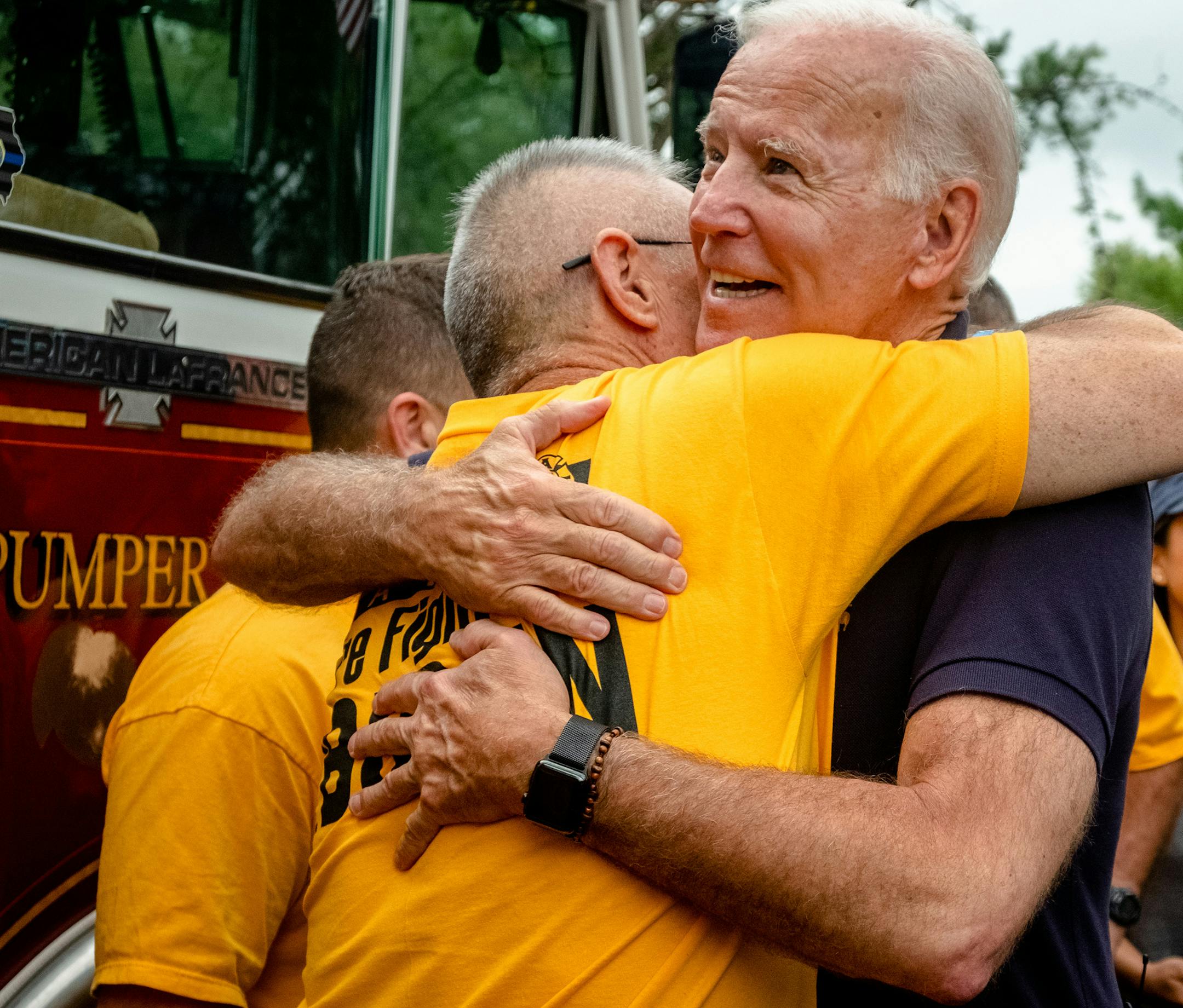 Former Vice President Joe Biden, a Democratic presidential hopeful, embraces an attendee at the Polk County Democrats' annual Steak Fry in Des Moines, Iowa, on Saturday, Sept. 21, 2019. (Hilary Swift/The New York Times)