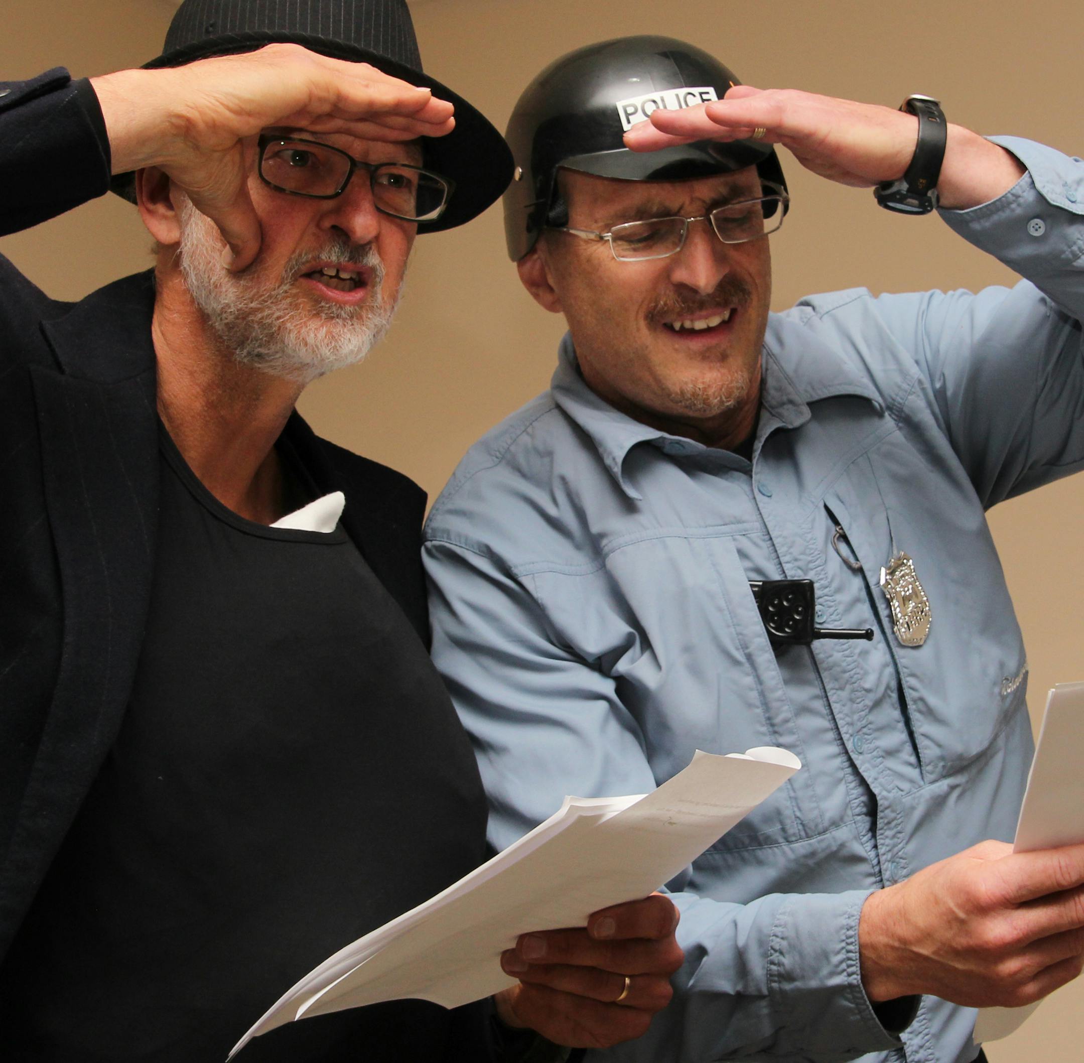 Tony Schmitz, left, does a dramatic reading of ‚ÄúThe Fatman Descends‚Äù with his friend Bart Cannon in the role of Roscoe, the cop. Photo by Kimerly Miller (Kimerly is correct, apparently, without a b)