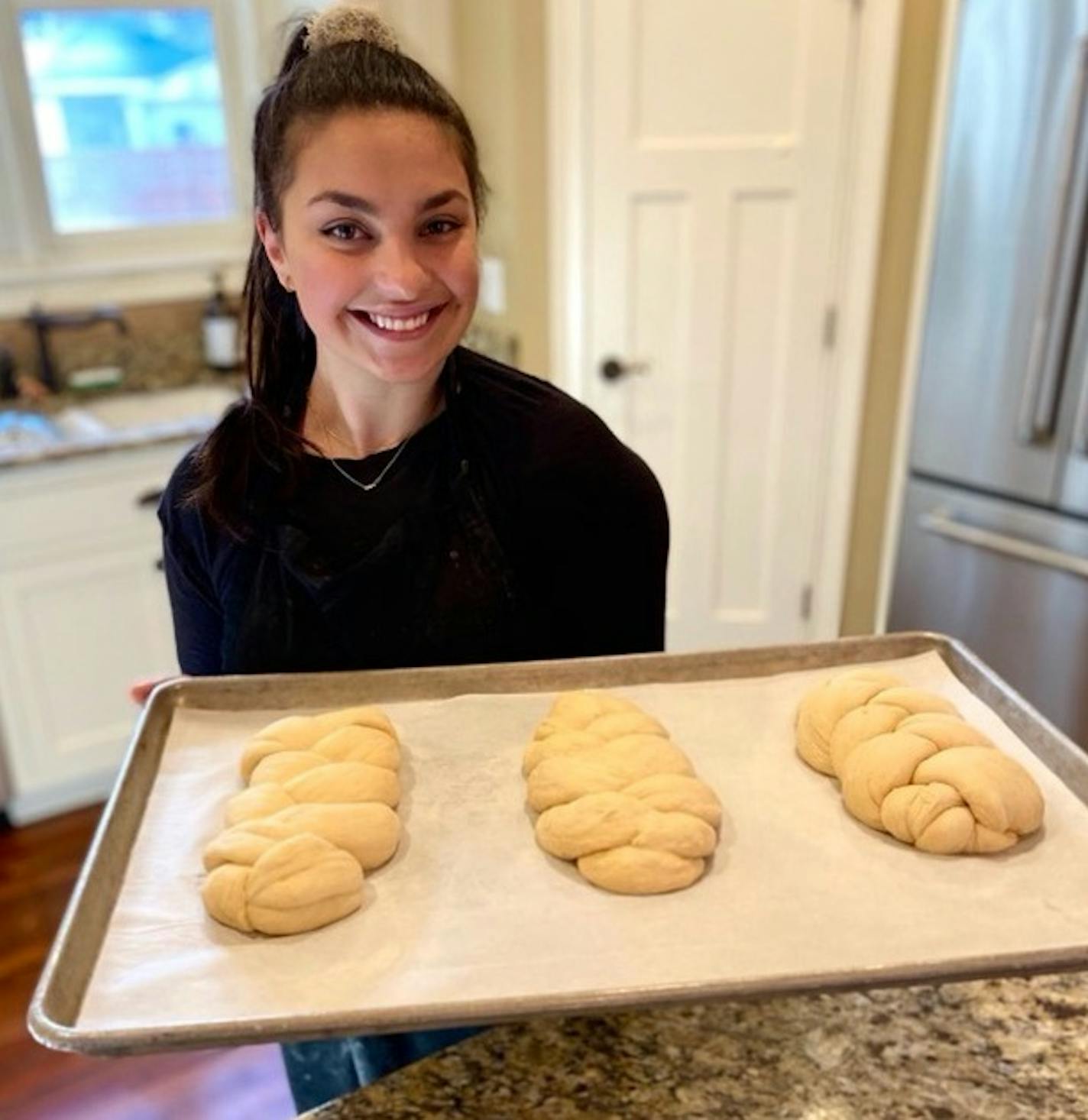 Morgan Dachis bakes challah from her mother's Edina kitchen.