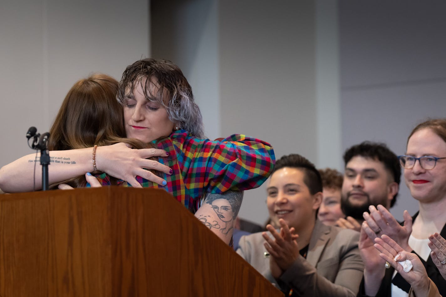 Rep. Leigh Finke, DFL-St. Paul, author of the "trans refuge" bill hugged Lt. Gov. Peggy Flanagan Thursday morning at the signing ceremony.