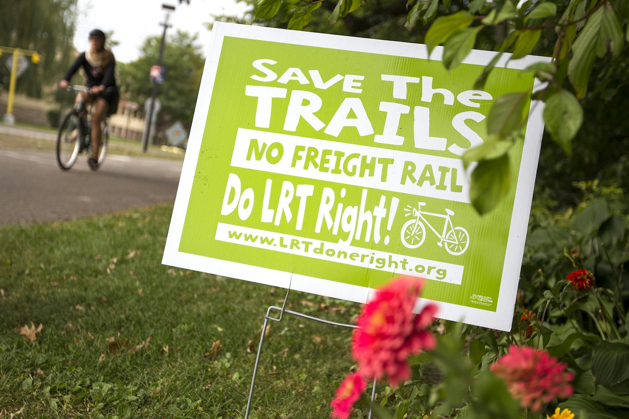 A yard sign on Cedar Lake Parkway speaks to the proposed freight rail issue along Kenilworth Trail in Minneapolis September 27, 2013. (Courtney Perry/Special to the Star Tribune) ORG XMIT: MIN1309271555564337