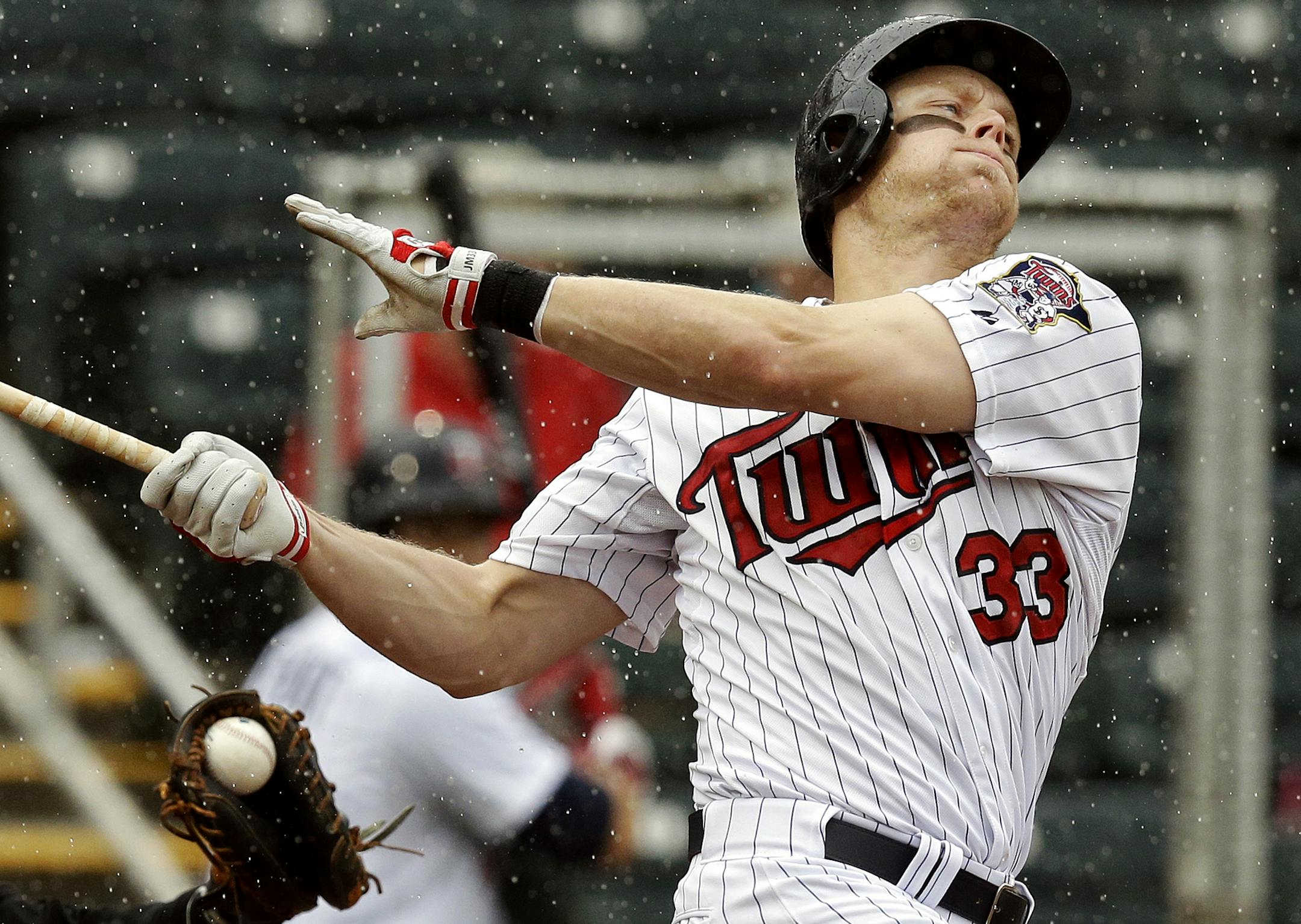 Minnesota Twins Justin Morneau swings and misses for a strike against Miami Marlins starting pitcher Nate Eovaldi in the fifth inning of an exhibition spring training baseball game in Fort Myers, Fla., Monday, March 18, 2013. (AP Photo/Elise Amendola)
