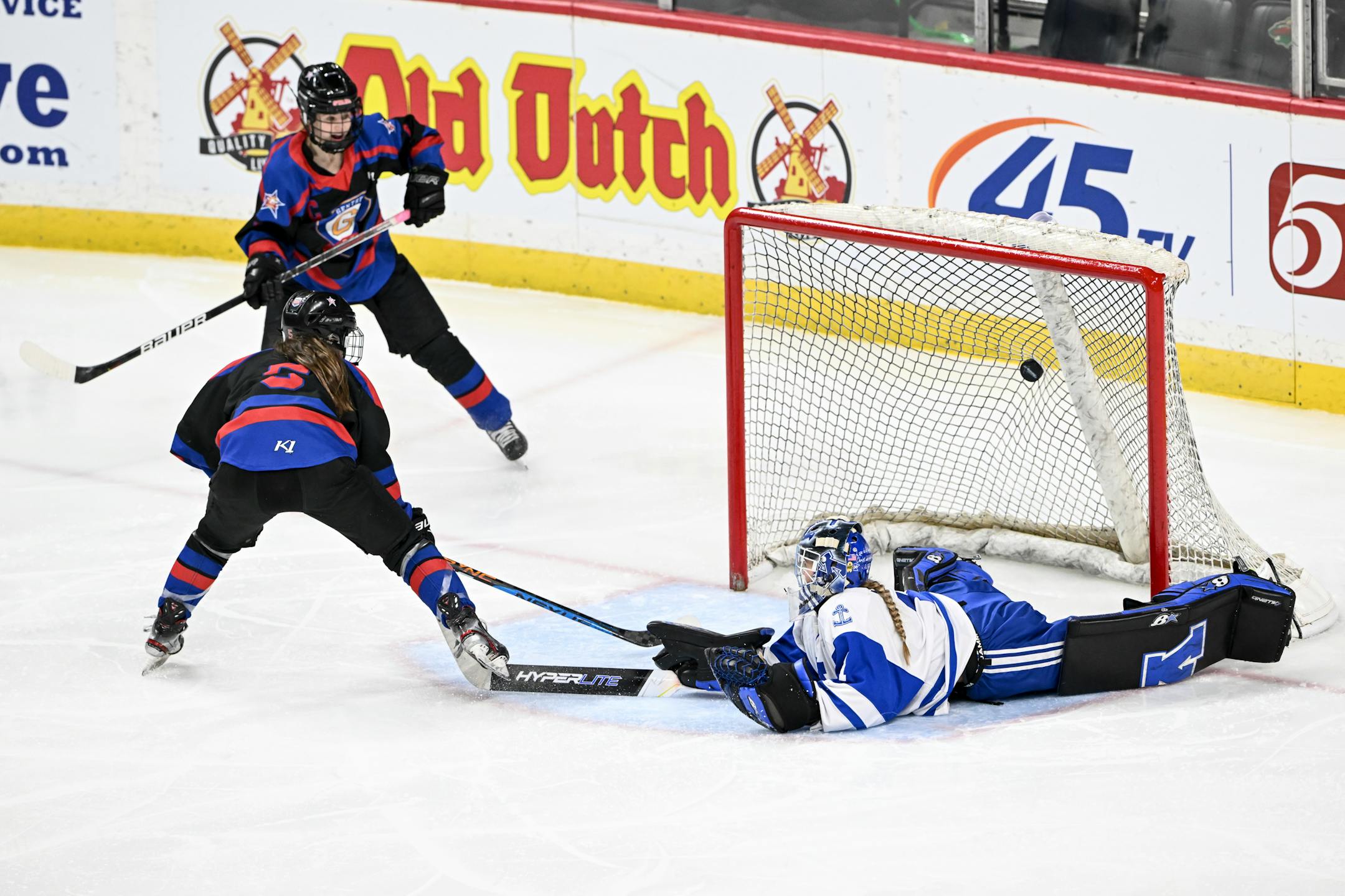 Gentry forward Alexa Hanrahan (5) scores a goal against Minnetonka goaltender Layla Hemp (1) during the third period.