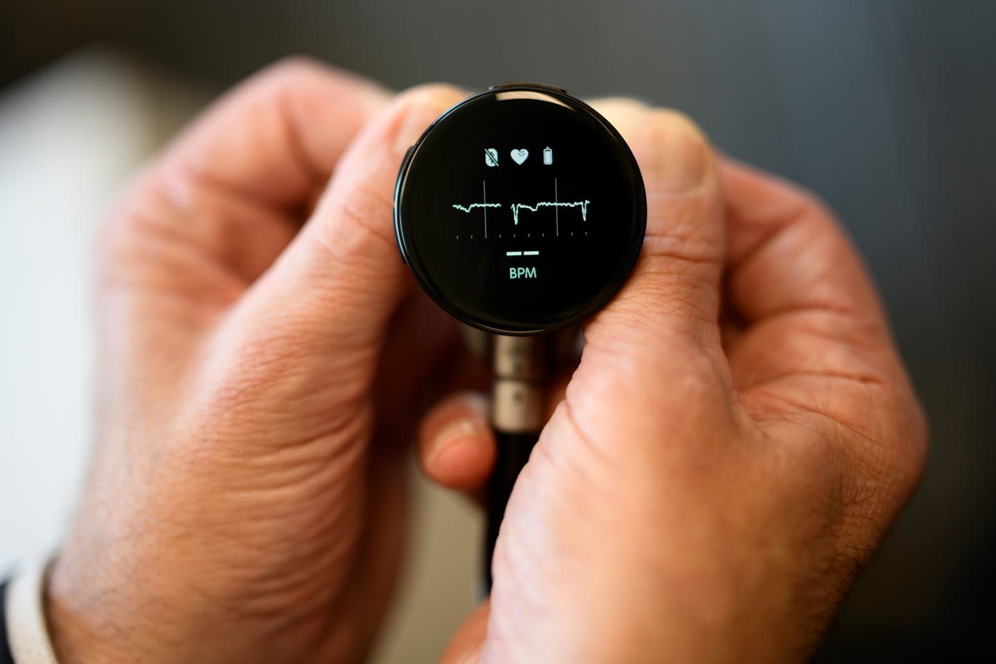 Dr. Paul Friedman, a Mayo cardiologist, holds a digital stethoscope, which can take electrocardiograms and feed data into the hospital’s AI systems.