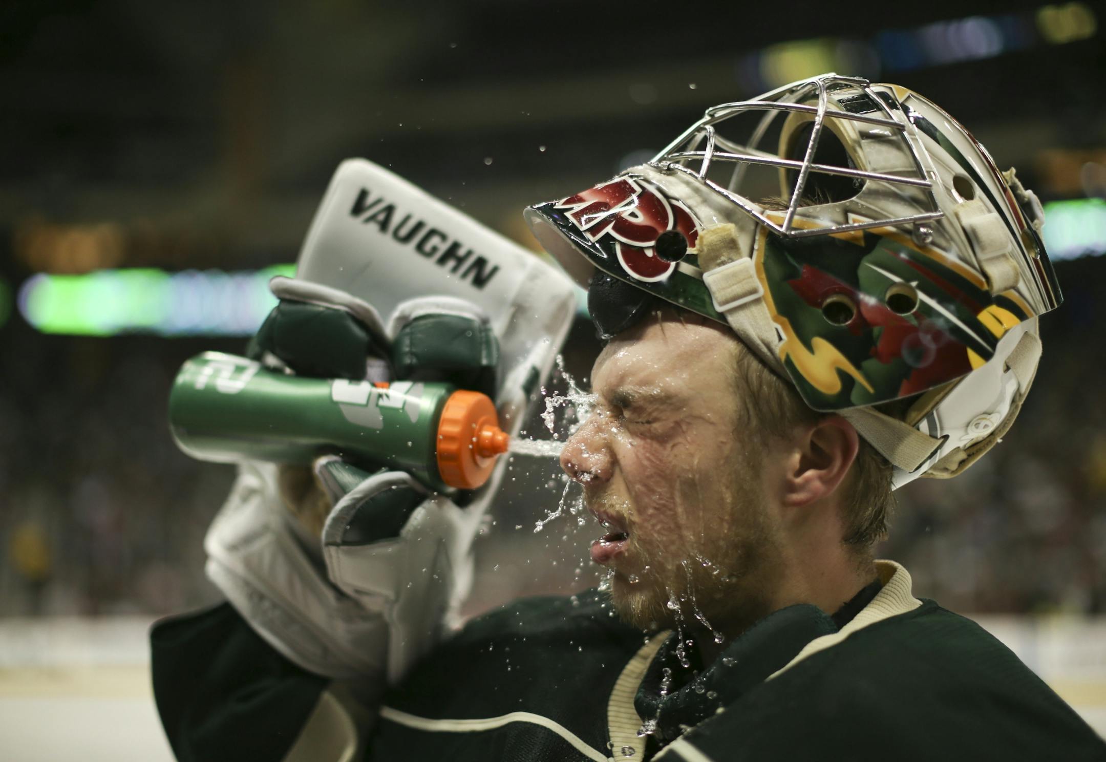 Minnesota Wild goalie Darcy Kuemper (35) cooled off during a stop in play in the second period Monday night at Xcel Energy Center.