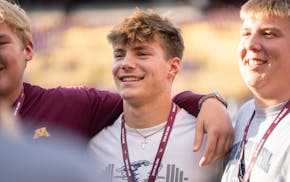 Roman Voss poses for a photo with fellow recruits before the Minnesota Gophers play the Iowa Hawkeyes at Huntington Bank Stadium in Minneapolis, Minn.