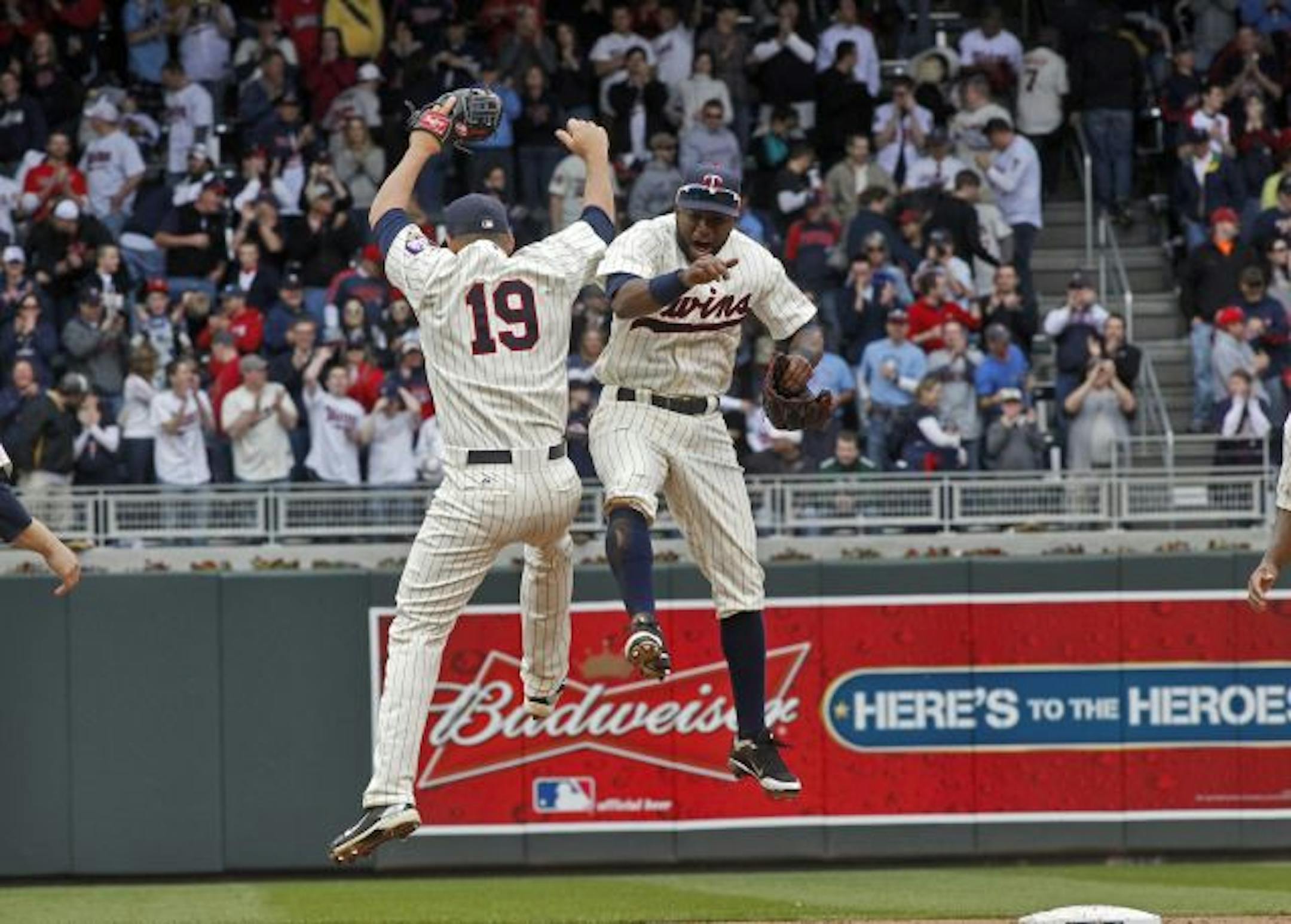 Twins Danny Valencia (19) and Denard Span celebrated the voctory at the end of the game.