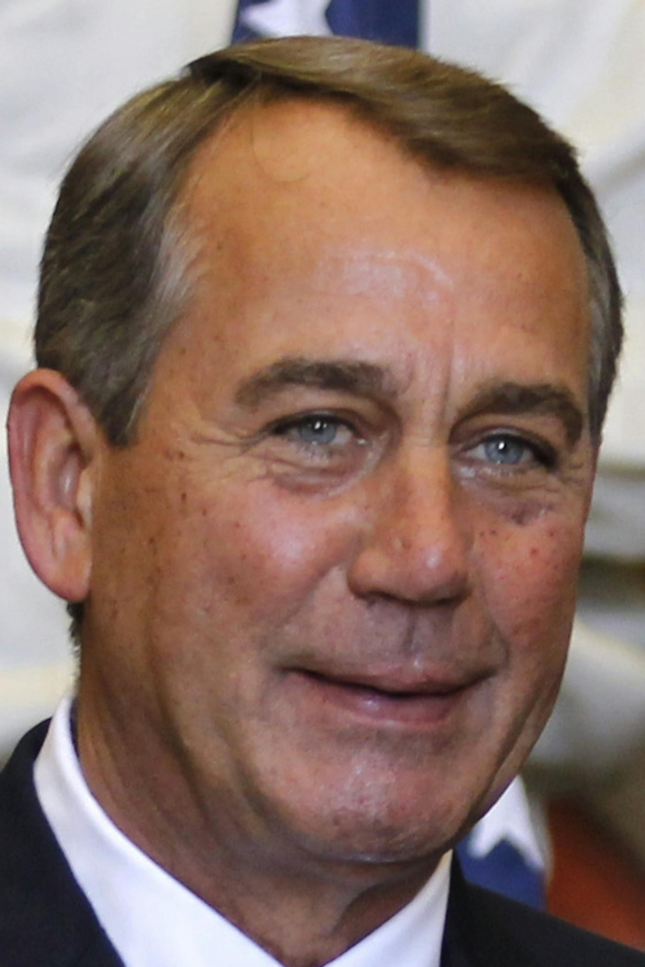 U.S. House Speaker John Boehner, left, receives a gift from the President of the Portuguese parliament Assuncao Esteves before their meeting at the Portuguese parliament, in Lisbon, Thursday, April 17, 2014. Boehner is on visit in Lisbon as part of an international trip that includes Afghanistan and Abu Dhabi. (AP Photo/Francisco Seco)