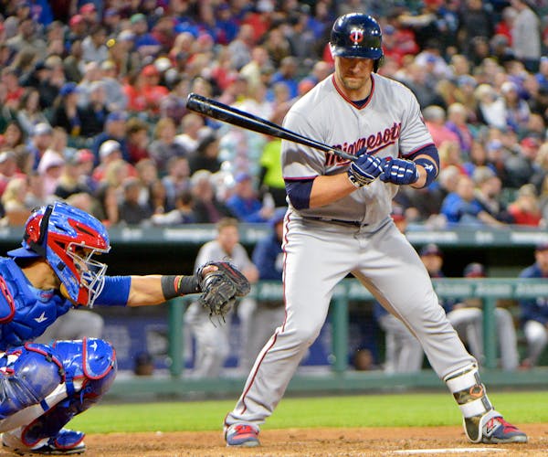The Twins' Chris Gimenez draws a walk during the fourth inning of a game in April against the Rangers at Globe Life Park in Arlington