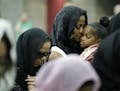Muhammad Ali's wife Lonnie and her daughter Laila attend Muhammad Ali's Jenazah, a traditional Islamic Muslim service, in Freedom Hall, Thursday, June