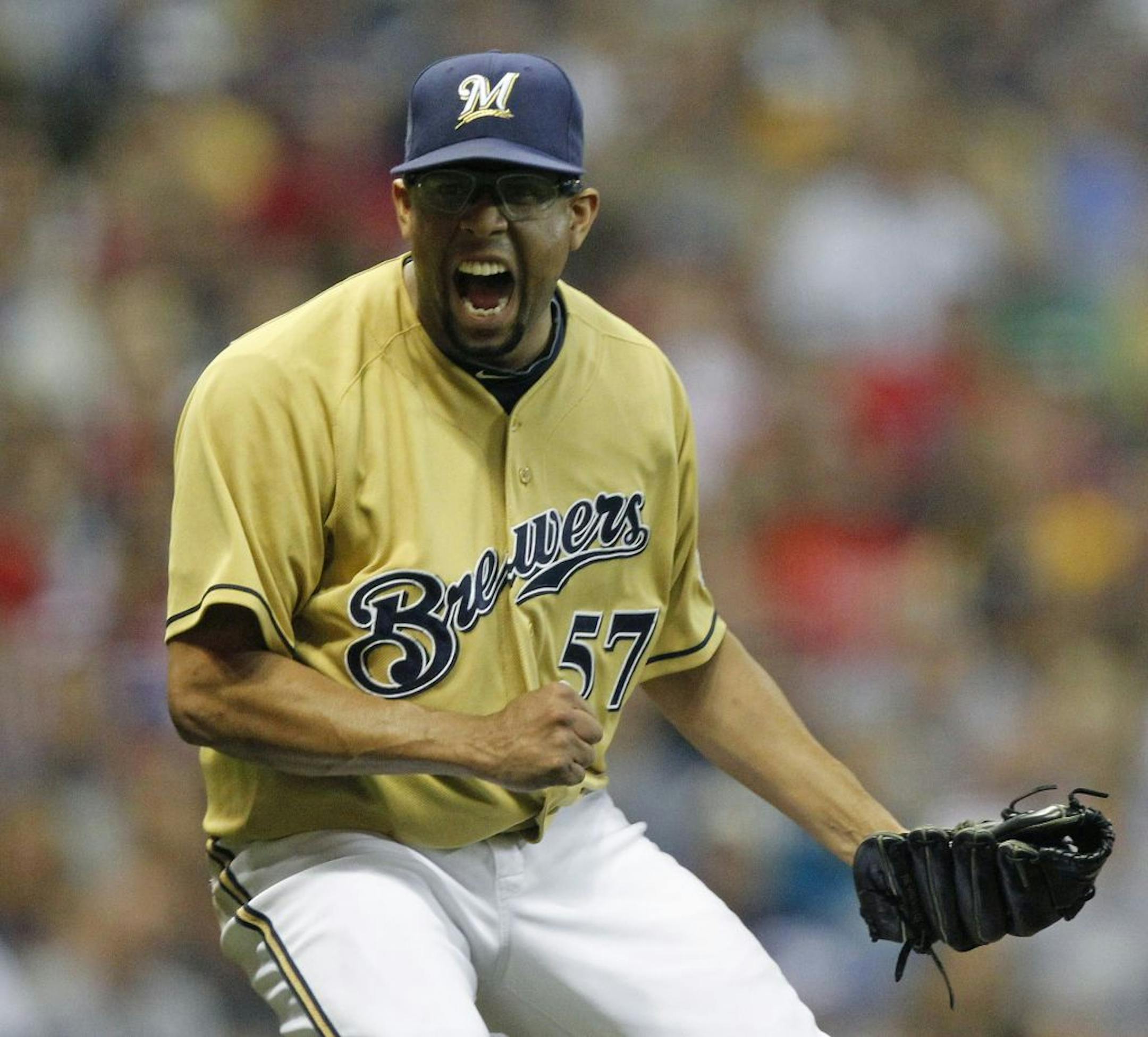 Milwaukee Brewers' Francisco Rodriguez reacts after striking out Philadelphia Phillies' Ross Gload to end the eighth inning of a baseball game, Saturday, Sept. 10, 2011, in Milwaukee.