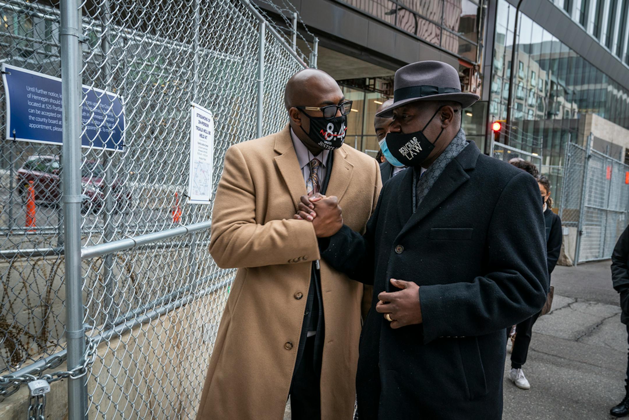 Philonise Floyd left, and Rodney Floyd, center in back, brothers of George Floyd, enter the Hennepin County Government Center with attorney Ben Crump, right. (Leila Navidi/Minneapolis Star-Tribune/TNS) ORG XMIT: 13585403W
