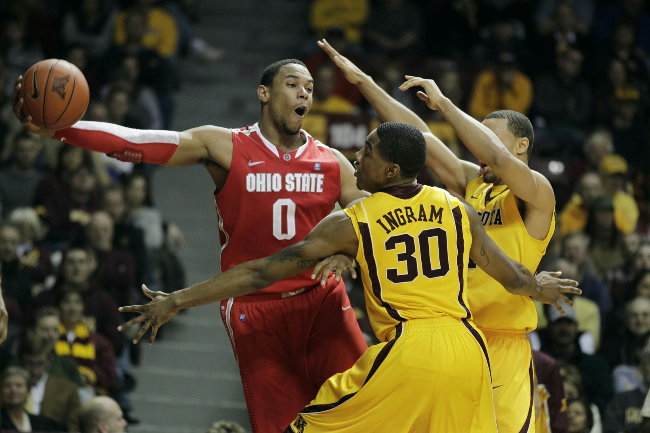 Ohio State's Jared Sullinger kept the Gophers' Andre Ingram and Joe Coleman at arm's length on Tuesday night. Sulliger had 23 points and eight rebounds in the Buckeyes' 78-68 victory.