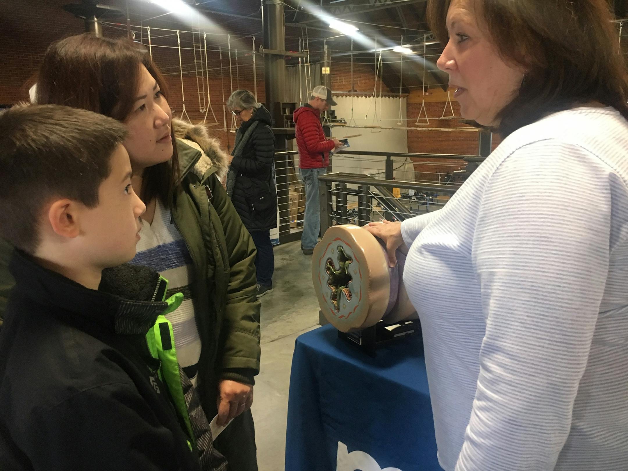 Ethan Anderson 10, and his mother, Fransiska, of Eden Prairie listened as Susan Ross, a registered nurse and clinical adviser for the Minnesota Department of Health's Asthma Program, used a plastic model to show how lung tissue swells during an asthma attack.