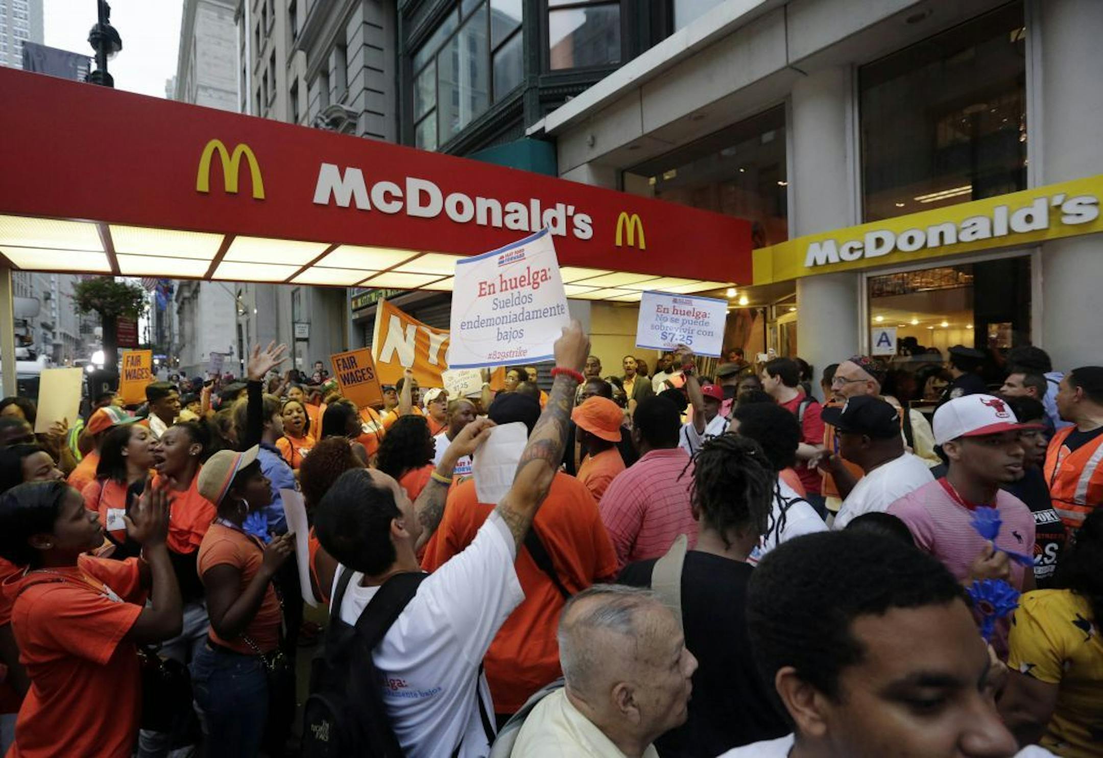 Protesting fast food workers demonstrate outside a McDonald's restaurant on New York's Fifth Avenue, Thursday, Aug. 29, 2013. Organizers say thousands of fast-food workers are set to stage walkouts in dozens of cities around the country Thursday, part of a push to get chains such as McDonald's, Taco Bell and Wendy's to pay workers higher wages.