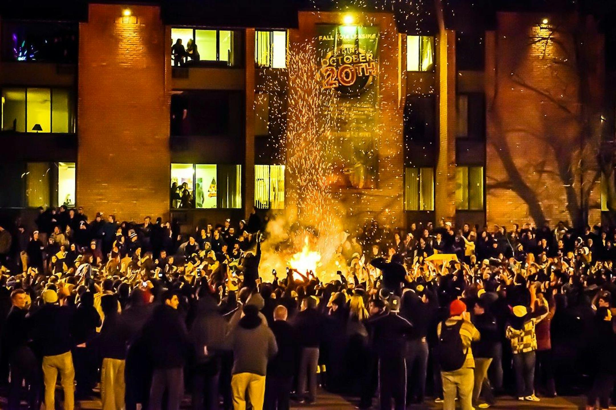 MSU fans riot outside Cedar Village in celebration early Sunday of the MSU football win over Ohio State.