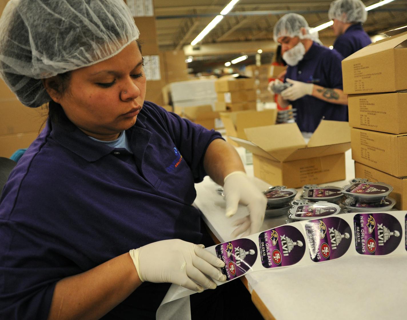 Adults with disabilities at nonprofit Opportunity Partners in Minnetonka worked on 100,000+ Super Bowl cake decorations in 2013.