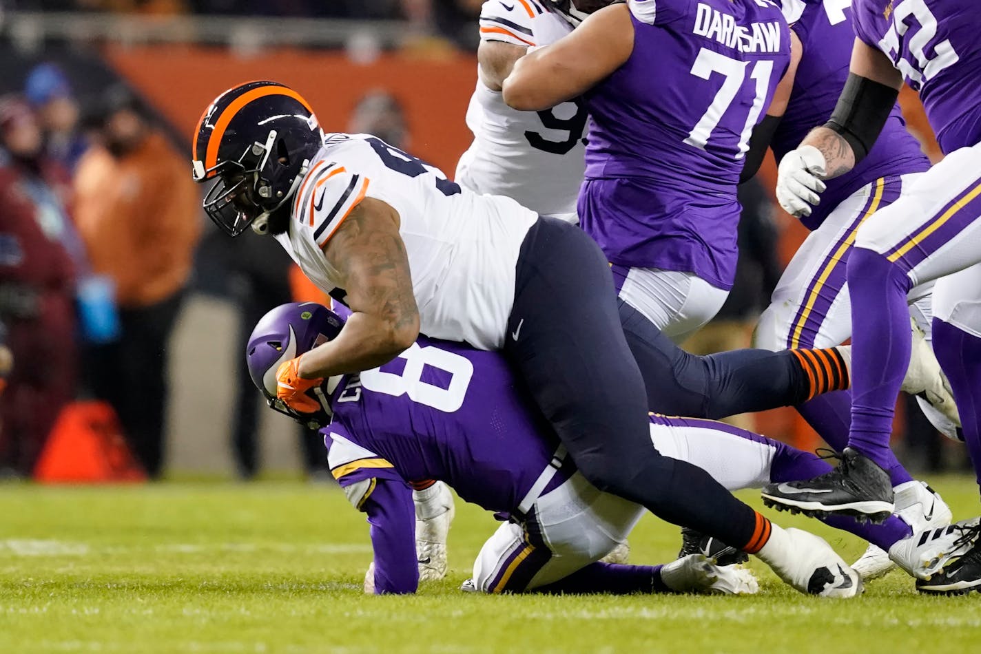 Chicago Bears defensive end Akiem Hicks sacks Minnesota Vikings quarterback Kirk Cousins during the first half of an NFL football game Monday, Dec. 20, 2021, in Chicago. (AP Photo/David Banks)