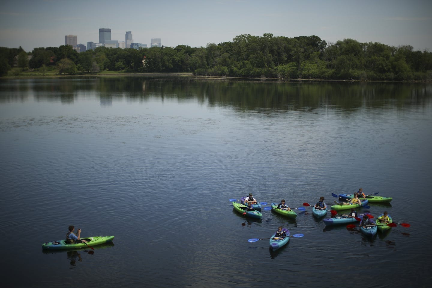 Kayakers on an expedition posed for a photo by their leader after entering Lake of the Isles Tuesday afternoon in Minneapolis.