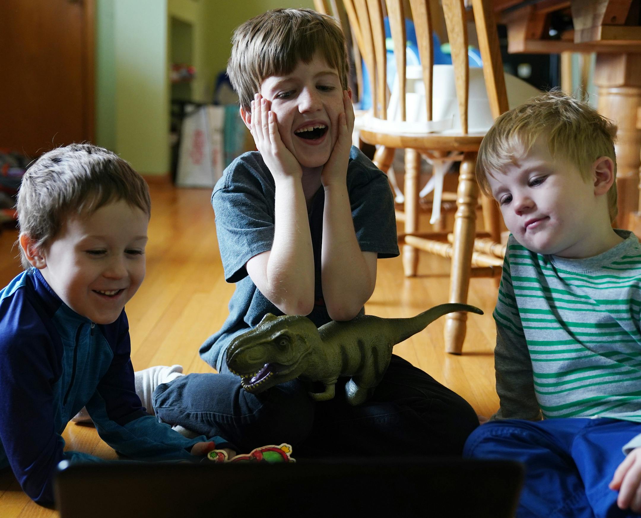 From Shakopee to Kuwait: From left, Franklin, 6, Calvin, 9, and Norman, 4, had a video chat with their mom, Capt. Elizabeth Clapero, who is in the Minnesota National Guard.