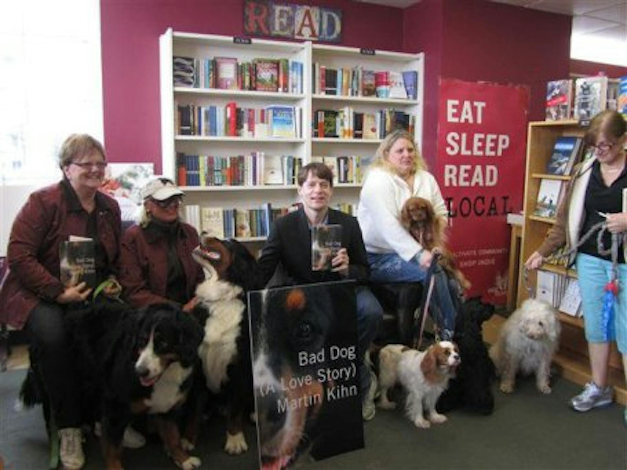 Martin Kihn, surrounded by dogs and readers, at the Bookcase in Wayzata. Photo by Linda White