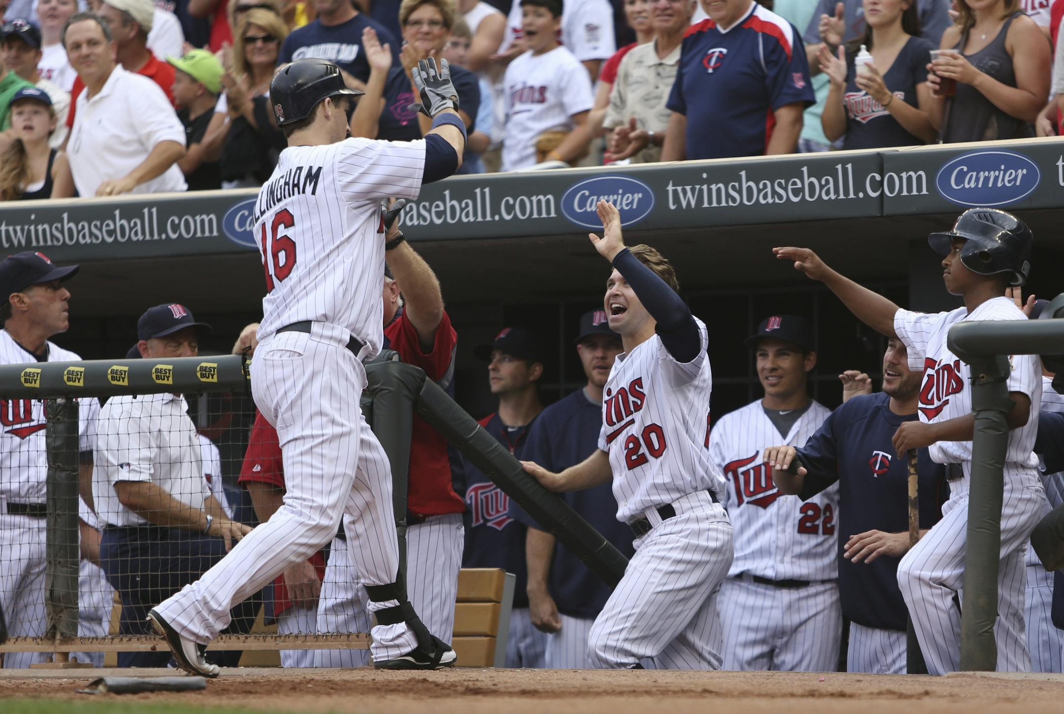 Twins Josh Willingham was greeted by Brian Dozier and the rest of the team after hitting a two-run homerun during the fourth inning at Target Field in Minneapolis Min., Saturday, July 28, 2012. Twins won 12-5 against Cleveland.