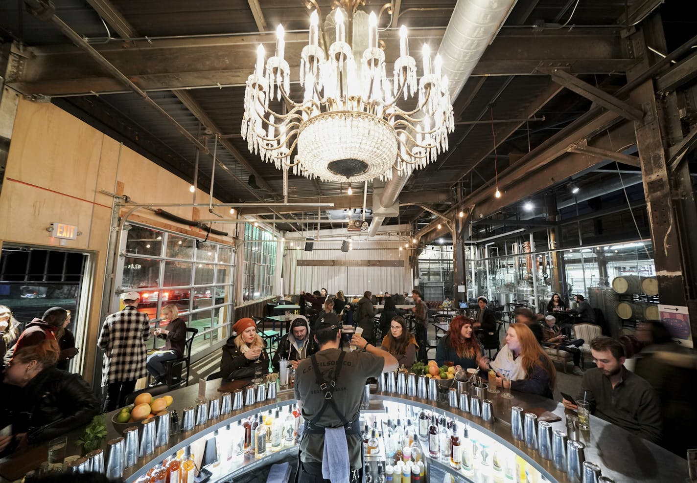 Bartender Brandon Gonzalez mixed beverages for guests at the bar at Tattersall Distilling in Minneapolis.