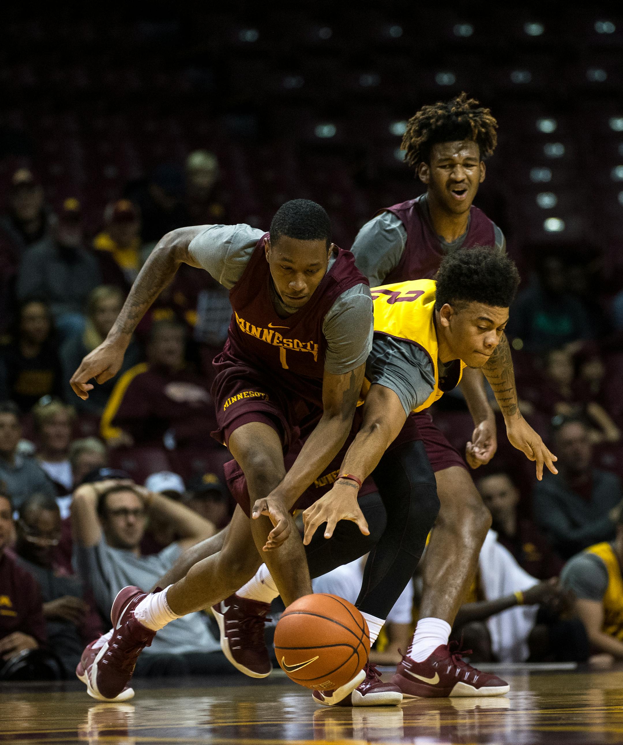 Gophers guards Dupree McBrayer, left, and guard Nate Mason battled for the ball during Saturday afternoon&#x2019;s scrimmage at Williams Arena.