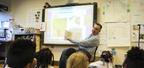 Kindergarten teacher David Boucher talked to his class about parts of a tree during class at Folwell School, Performing Arts Magnet School on Tuesday,