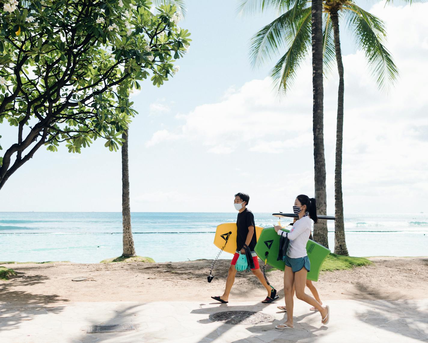 Beachgoers in the Waikiki neighborhood of Honolulu on Wednesday, July 8, 2020. Gov. David Ige of Hawaii has been criticized for keeping his inner circle too small by excluding the lieutenant governor, according to local media reports. (Michelle Mishina-Kunz/The New York Times)