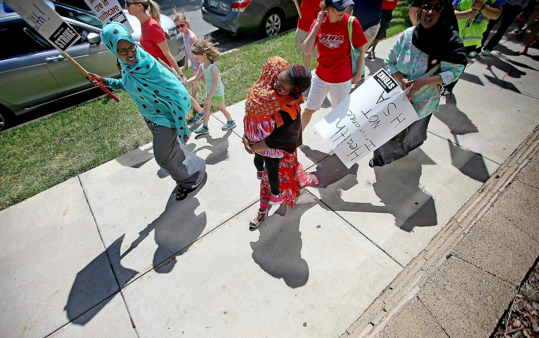 Members of the Minnesota Nurses Association and their families made their way around Abbott Northwestern Hospital as they continued their strike, Monday, June 20, 2016 in Minneapolis, MN.