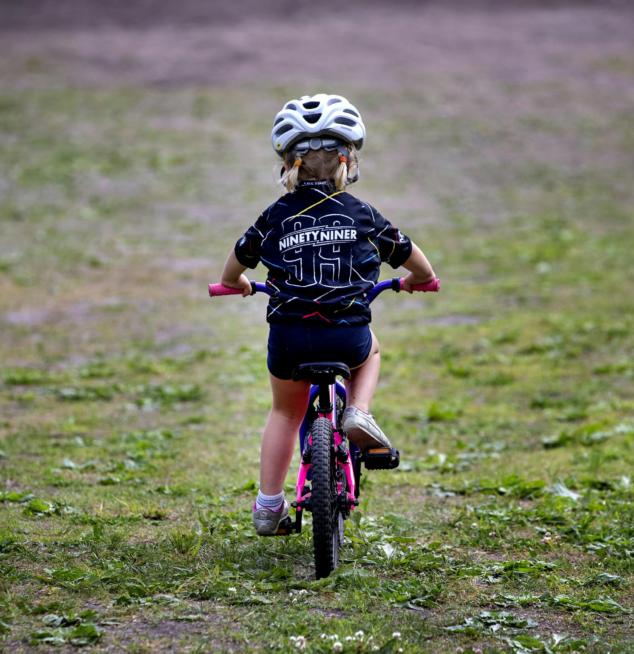 Hadley Rickert, 4, of Maple Grove rode her bike down a hill at Theodore Wirth Park. ] CARLOS GONZALEZ ¥ cgonzalez@startribune.com Ð Minneapolis, MN Ð June 19, 2019, Wirth on Wednesdays kicked off this month, with a bike race series., Theodore Wirth Park
