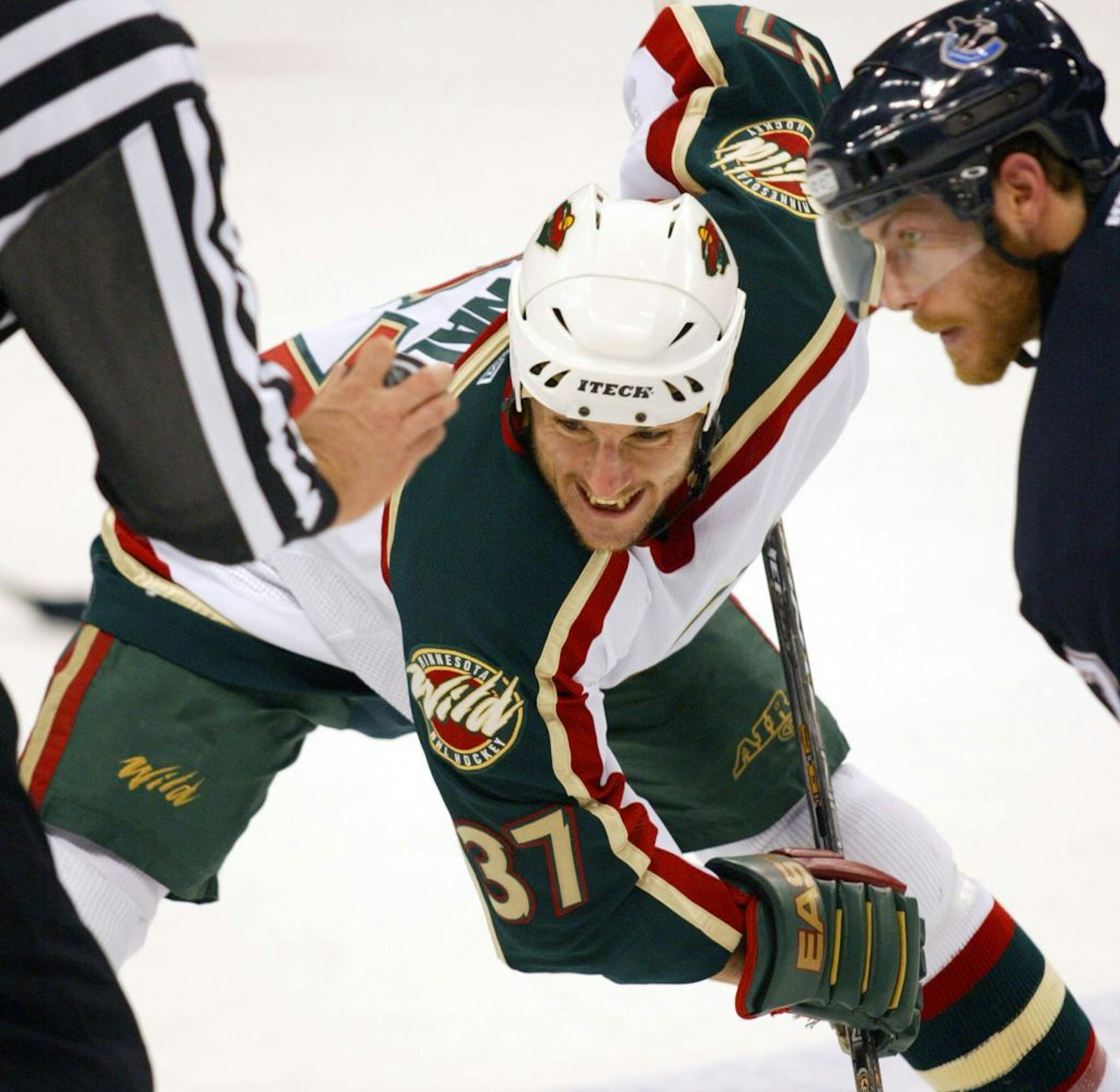 St. Paul, MN 5/2/2003 Minnesota Wild -VS- Vancouver Canucks Game 4 Minnesota Wild's #37 Wes Walz and Canucks Brendan Morrison wait for the drop of the puck during a face off in the 1st period.