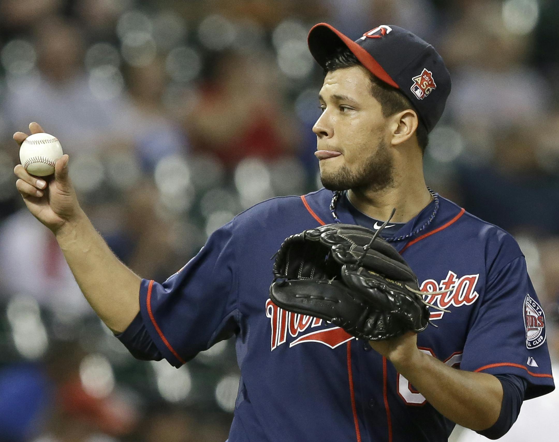 Minnesota Twins starting pitcher Yohan Pino looks to home plate after giving up aa RBI single to Houston Astros' Jose Altuve in the fifth inning of a baseball game Tuesday, Aug. 12, 2014, in Houston. (AP Photo/Pat Sullivan)