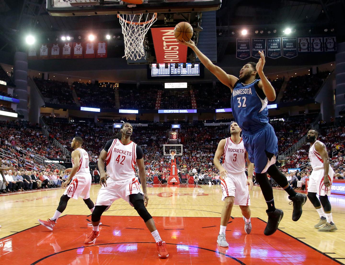 Minnesota Timberwolves' Karl-Anthony Towns (32) goes up for a shot against the Houston Rockets during the first half of an NBA game, Wednesday, April 12, 2017, in Houston.