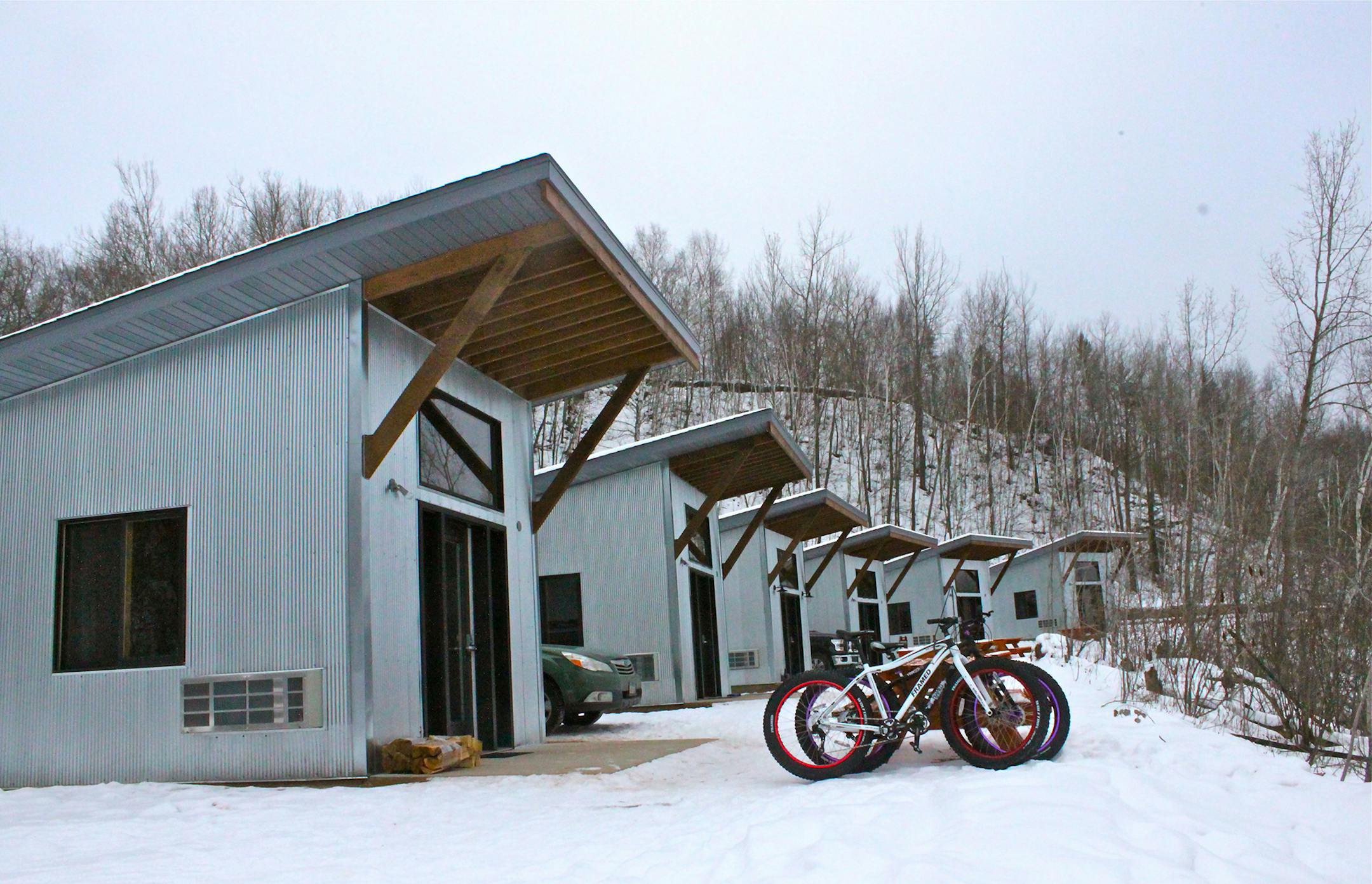 True North Base Camp cabins are medal and wood structures styled after old mine sheds that speak to the region's history.