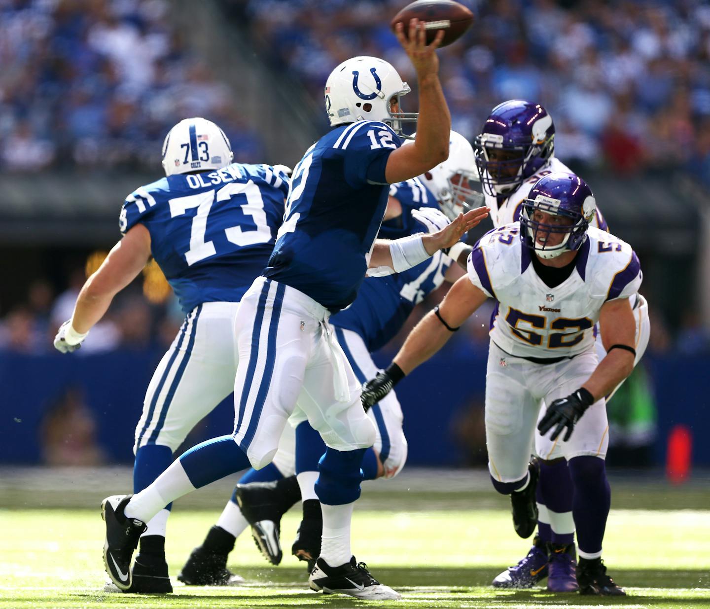 Indianapolis Colts quarterback Andrew Luck (12) throws a pass by Minnesota Vikings outside linebacker Chad Greenway (52) during NFL matchup between the Minnesota Vikings and the Colts Sunday September 16, 2012, in Indianapolis, IN. at Lucas Oil Stadium. ] Jerry Holt/ STAR TRIBUNE.COM)