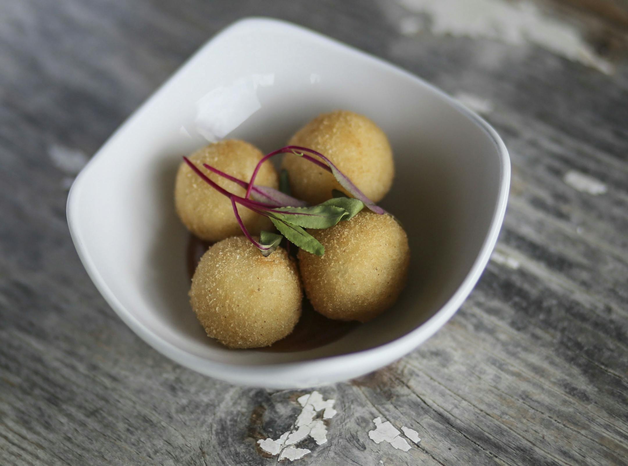 Hola Arepa, one of the city's great food trucks and now a restaurant, and arepitas with fried arepa balls stuffed with jalapeno and goat cheese, served with quince sauce Friday, Sept. 12, 2014, in Minneapolis, MN.