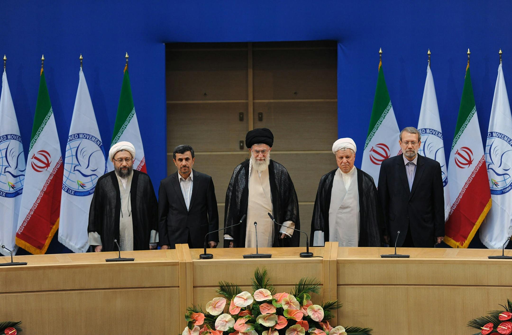 In this photo released by the official website of the Iranian supreme leader's office, supreme leader Ayatollah Ali Khamenei, center, parliament speaker Ali Larijani, right, chief of Expediency Council, Akbar Hashemi Rafsanjani, second right, President Mahmoud Ahmadinejad, second left, and judiciary chief Sadeq Larijani, left, listen to Iran's national anthem, at the opening session of the Nonaligned Movement, NAM, summit, in Tehran, Iran, Thursday, Aug. 30, 2012.
