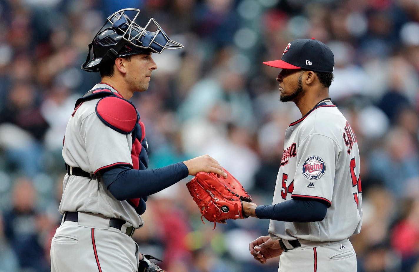 Twins catcher Jason Castro, left, talked with Twins starter Ervin Santana.