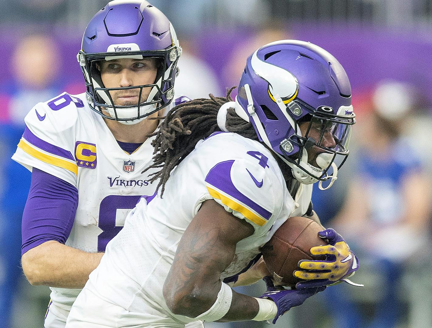 Minnesota Vikings quarterback Kirk Cousins (8) hands the ball to Minnesota Vikings running back Dalvin Cook (4) in the fourth quarter as the Minnesota Vikings take on the New York Giants at U.S. Bank Stadium, in Minneapolis, Minn., on Saturday, Dec. 24, 2022. ] Elizabeth Flores • liz.flores@startribune.com