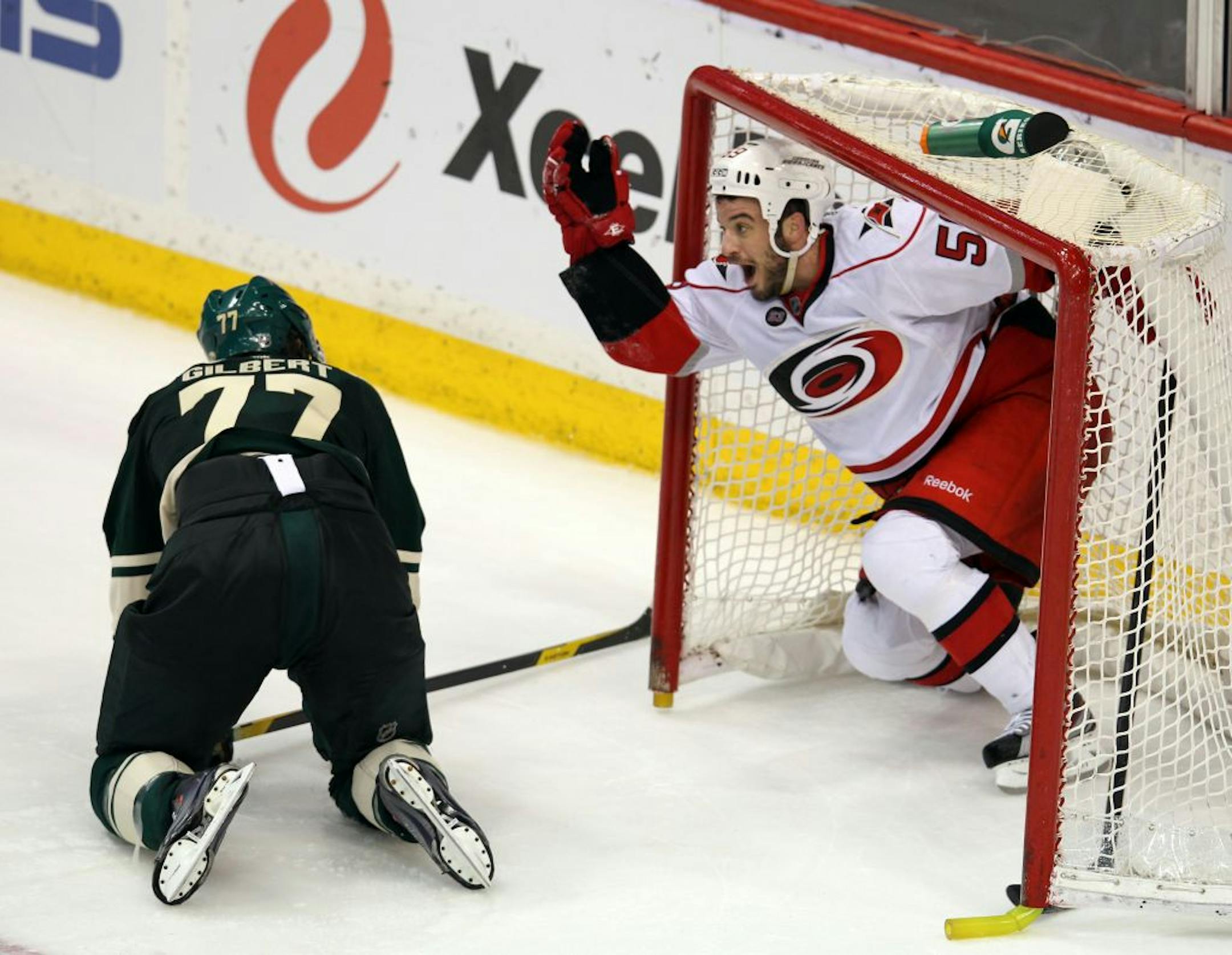 Carolina, Chad LaRose, 59, beat Tom Gilbert, 77, to the loose puck and scored a goal in the empty net with 1:33 to play in the third period. Minnesota Wild vs Carolina Hurricanes, March 17, 2012, at the Xcel Center St. Paul, Mn [TOM WALLACE • twallace@startribune.com _ Assignments #20021570IA_ March 17, 2011_ SLUG: wild0318_ EXTRA INFORMATION: cq'ed by program